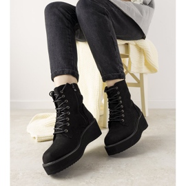 Black boots on a high Dexter sole 1