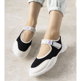 Black and white trainers with a holographic Melania insert 1