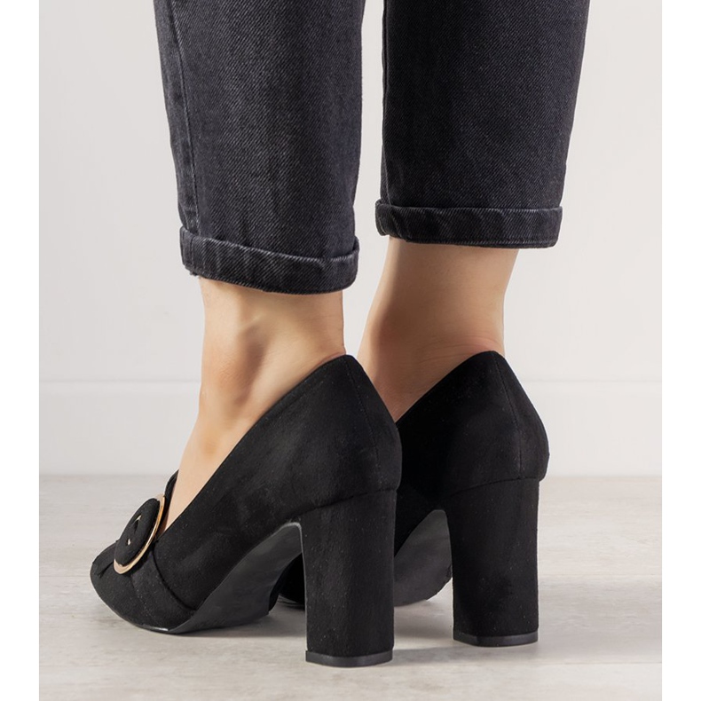 Black pumps on a post with a Promise buckle 1