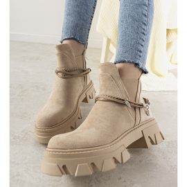 Beige boots with a Fearless bracelet 1