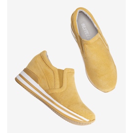 Mina's yellow wedge sneakers 1