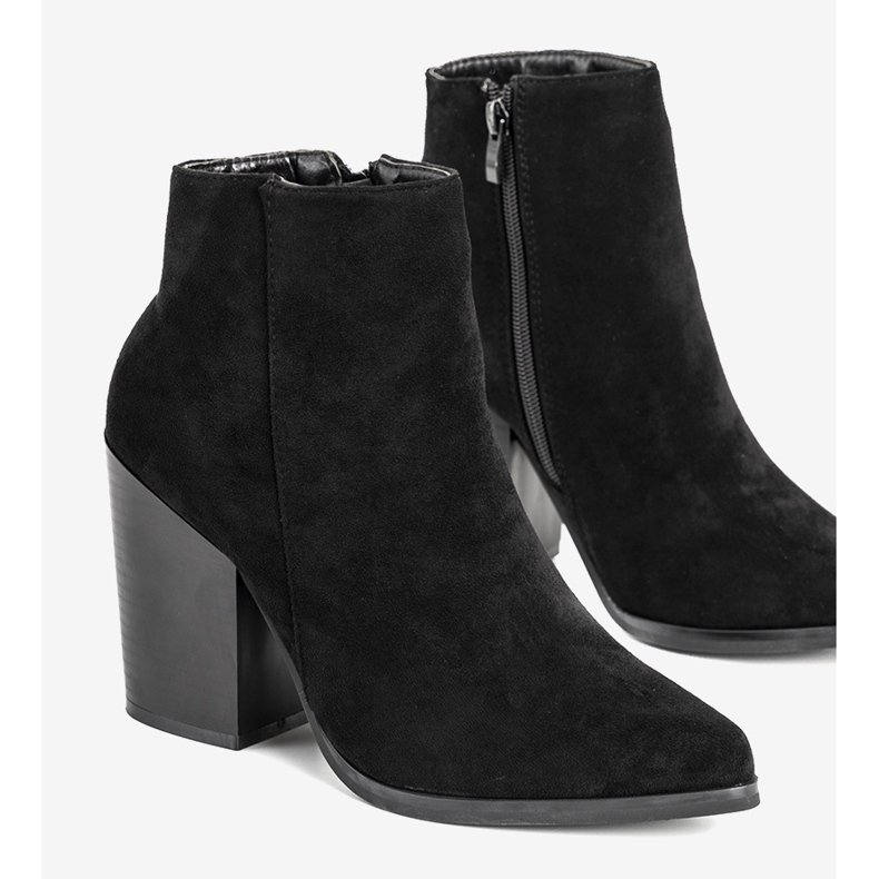 Black ankle boots on the post of Milady 1