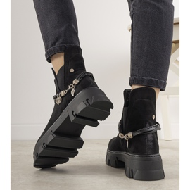 Black boots with a Fearless bracelet 1