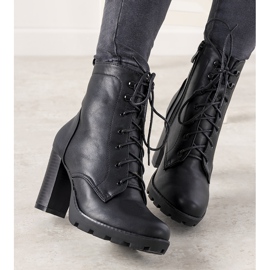 Black women's ankle boots with a binding on the Najera post 1