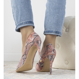 Red stilettos in Grace's snake skin pattern 1