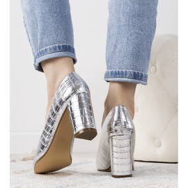 Silver pumps on the Cowen post 1