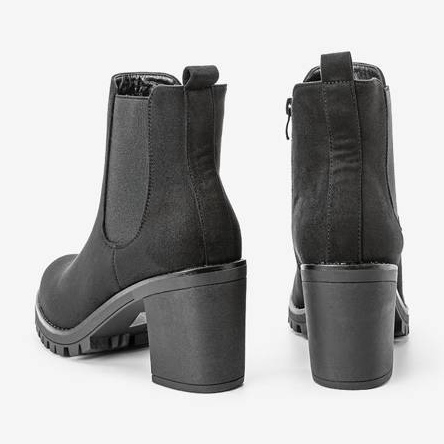 Black ankle boots on the Waikiki post 1