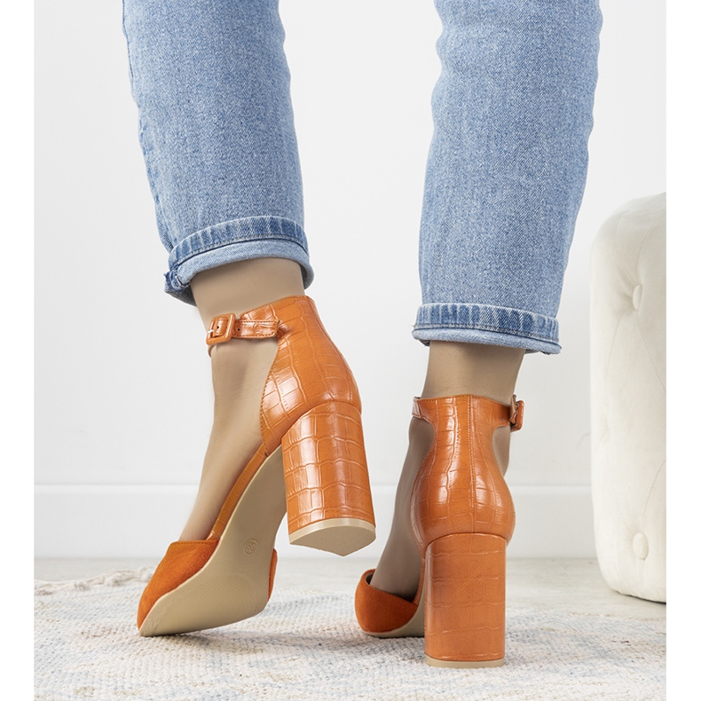 Orange pumps on the post of Natalie 2