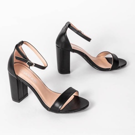 Black sandals on the post of Dorothy 1