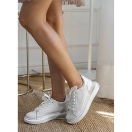 White trainers with a silver Run upper 1