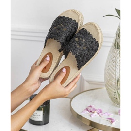 Black slippers on the Sudden Draft platform 1