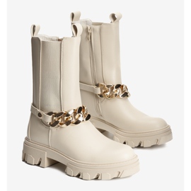 Beige boots with a gold Luce chain 1