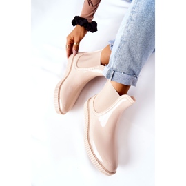 PS1 Shiny Rain Boots On A Beige Waterfall Platform 1