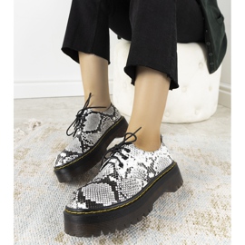 Black snakeskin motif on a thick Ronde sole white 1