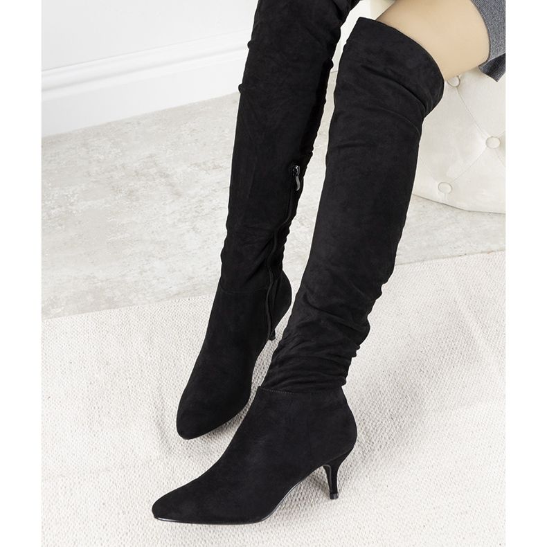 Black thigh-high boots from Delia 1