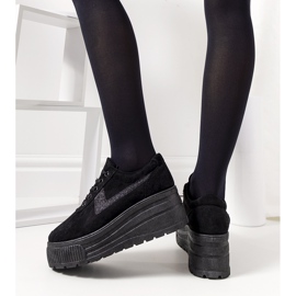 Black sneakers on a high botanical sole 1