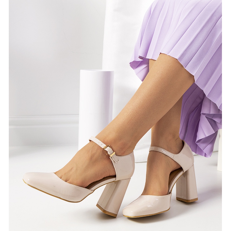 Beige pumps on the Clement post 1