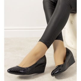 Navy blue pumps with a crocodile skin pattern on the Wildlife wedge 1