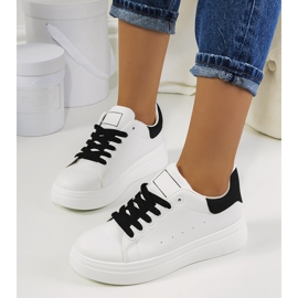 Black and white sneakers on the Justar platform 1