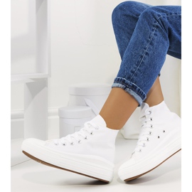 White sneakers on a high Tirado sole 1