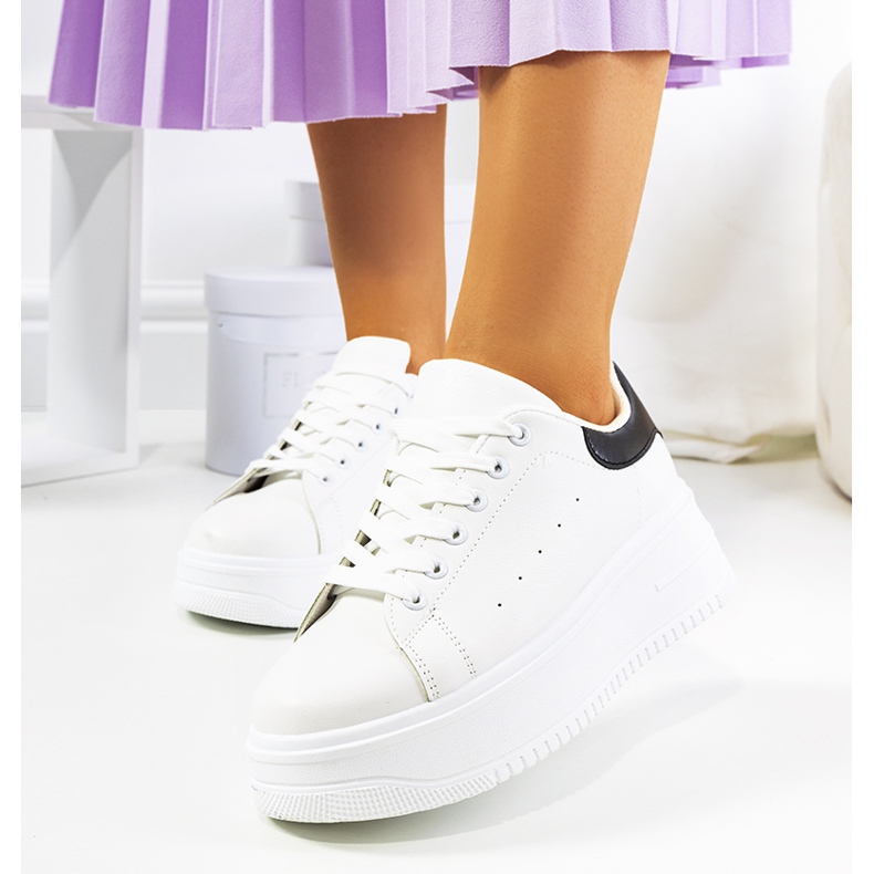 White sneakers on a high Lelica platform 1