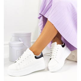 White sneakers on a high Lelica platform 2