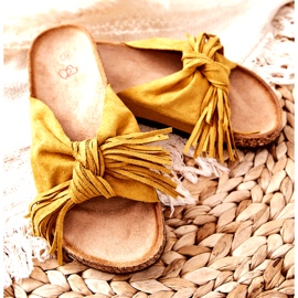 Yellow flip flops with a cork sole and fringes 2