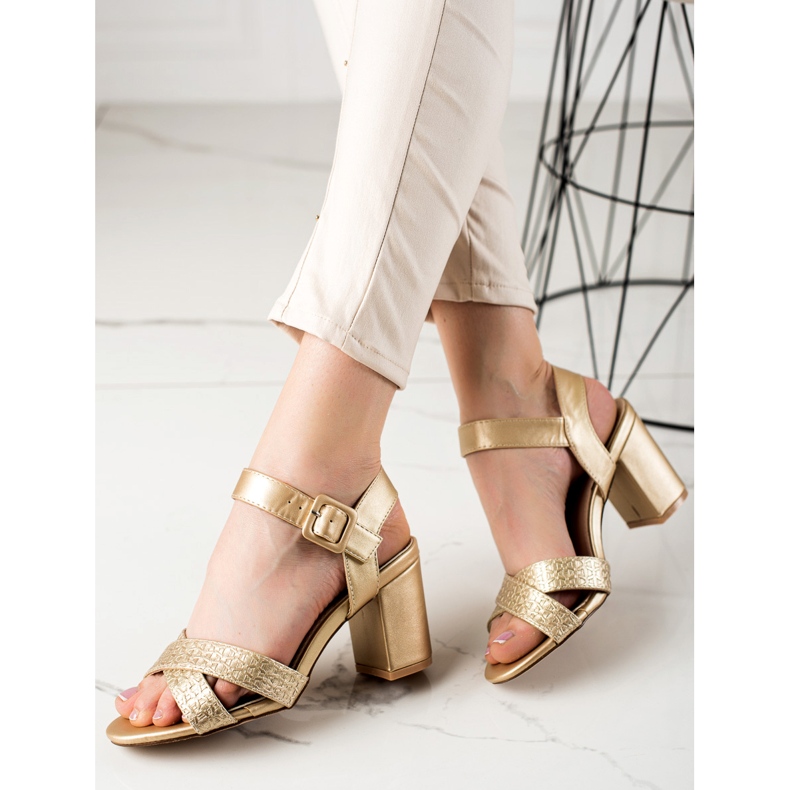 Encor Golden Sandals On A Bar 1