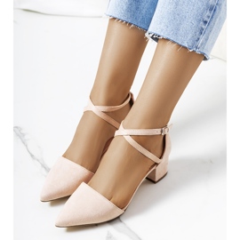 Beige pumps on the Hyde post 1