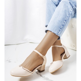 Beige pumps on a low Lynden post 1
