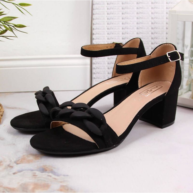 Black Sandals on a post with a chain W Filippo 2