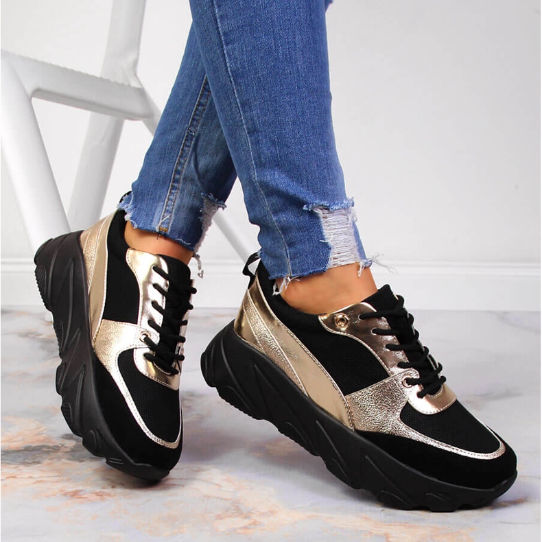 Women's sports shoes on the Potocki platform black golden 1