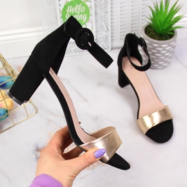 Black and gold women's sandals on the post eVento 1