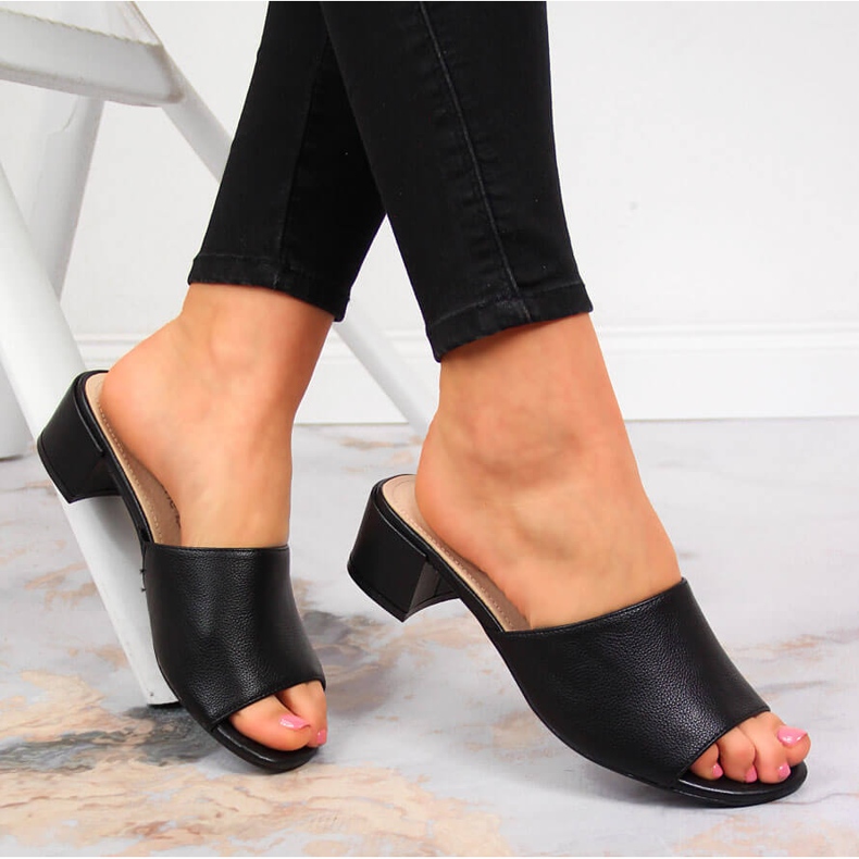 Women's black slippers on a block by Sergio Leone 1