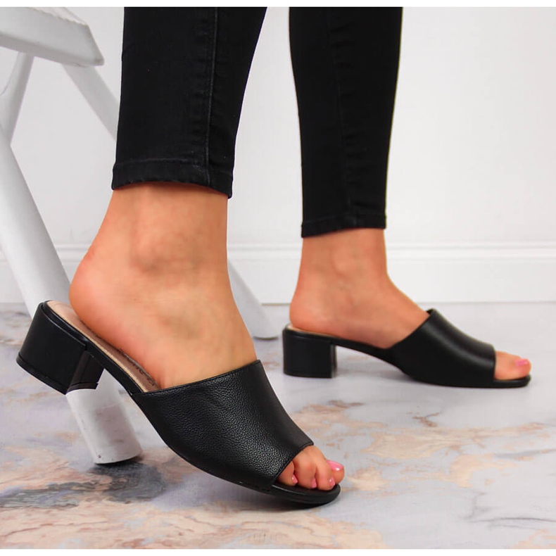 Women's black slippers on a block by Sergio Leone 2