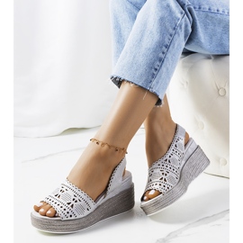 Silver openwork sandals on a Bible wedge heel 1