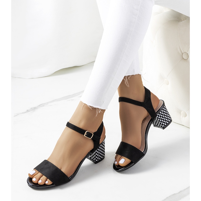 Black sandals on a Harbin post 1