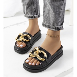 Black slippers on the Berloz platform 1