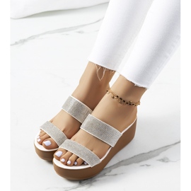 White slippers on the Marlien platform 1