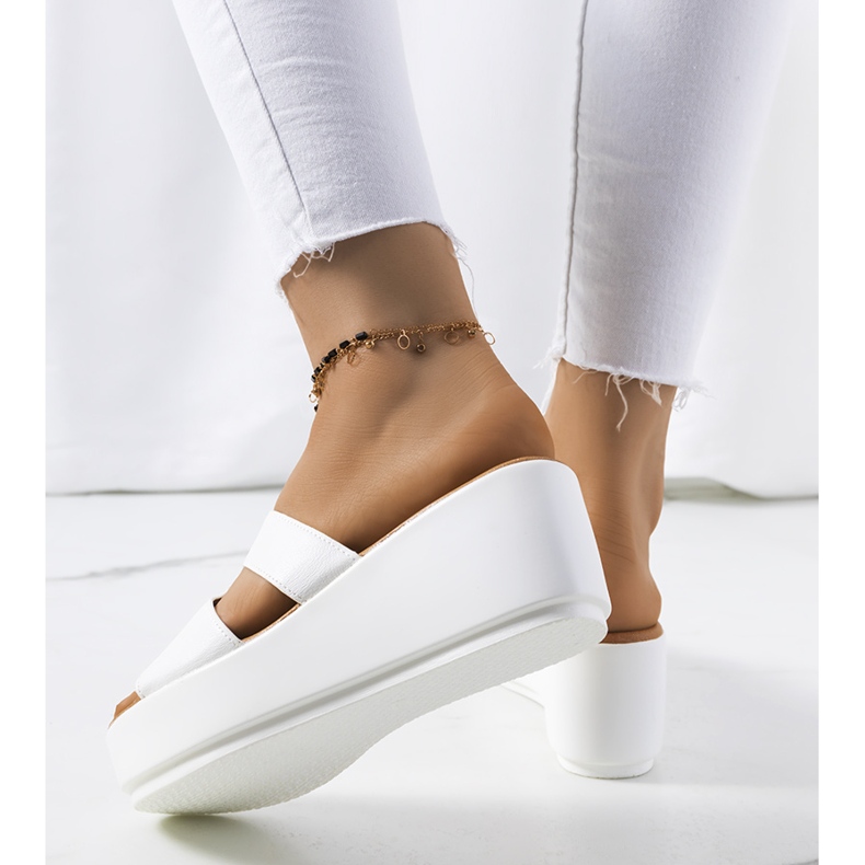 White slippers on the Duffel platform 1