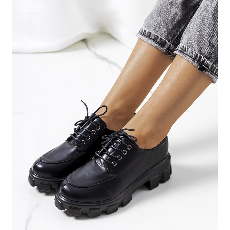 Black shoes on a Feline tractor sole 1