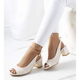 Gold openwork sandals on a Malone post golden 1