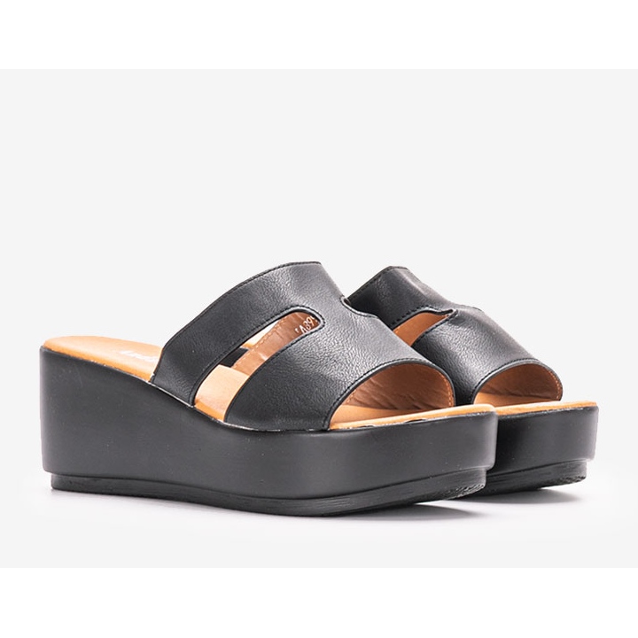 Black slippers on the Duffel platform 1