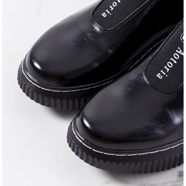 Black brogues on the Siddons platform 1