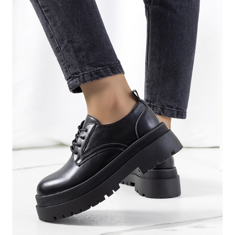 Black shoes on the Foxton platform 1