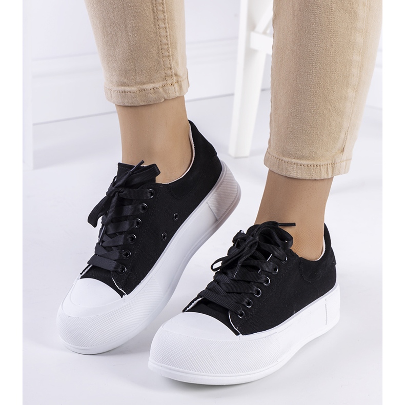 Black sneakers on the Kilkenny platform 1