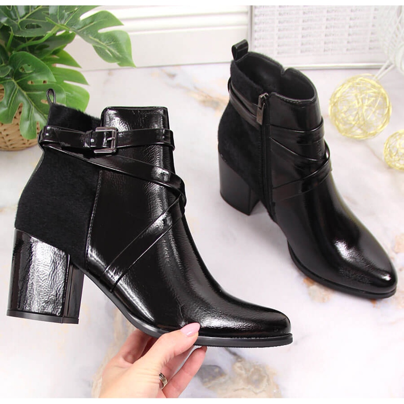 Black Laura La.Fi insulated boots with fur on a post 1