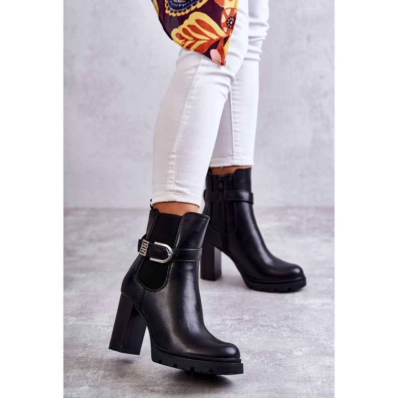 FE1 Black Maresol leather boots on a post with a decorative belt 1