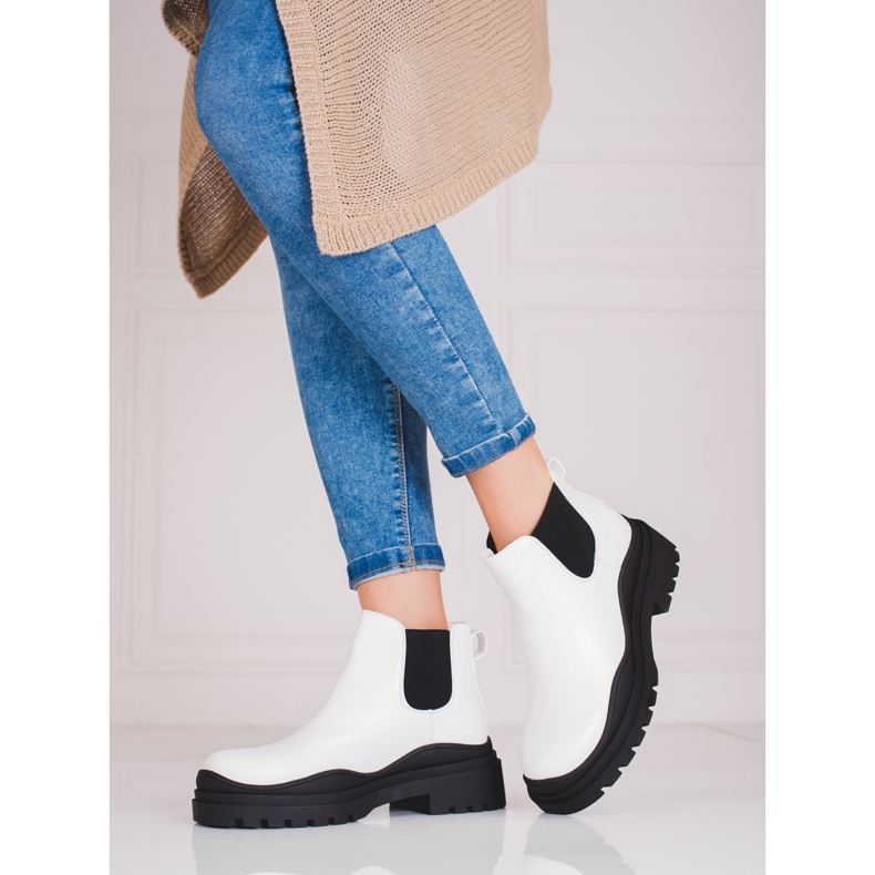 Black and white women's Chelsea boots on the platform 1