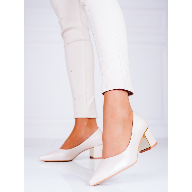 Ladies' beige pumps on a low Shelovet post 1